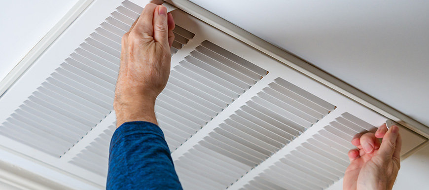 Man installing furnace filter